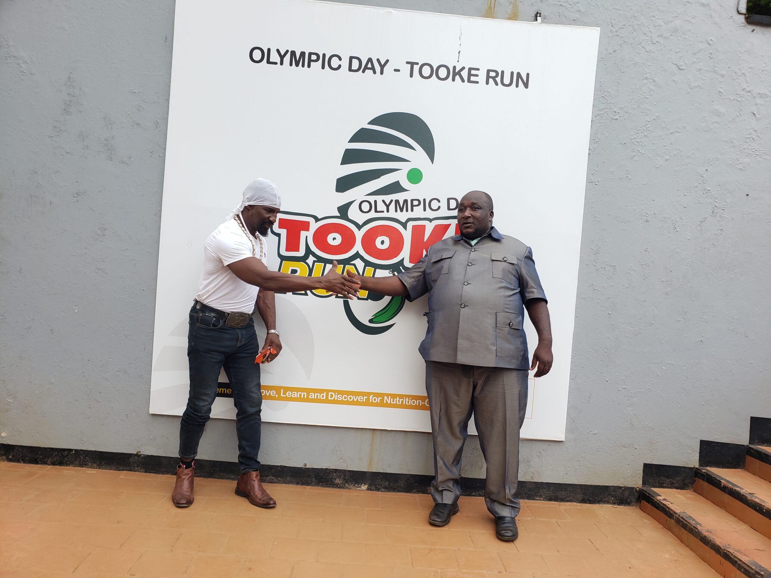 Golola Moses visits PIBID offices to support Bushenyi Tooke Run