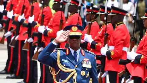 Getty Images Chief of Kenya Defence Forces General Francis Ogolla (C) gestures as Britain