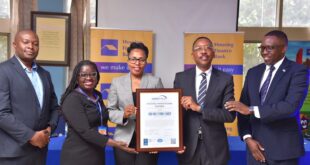 Housing Finance Bank Secures ISO 2700:2022 Certification, Reinforcing Commitment to Customer Data Security 10 Top Housing Finance Bank and Certi-Trust executives pose for a group photo with the ISO certificate during the handover in Kololo