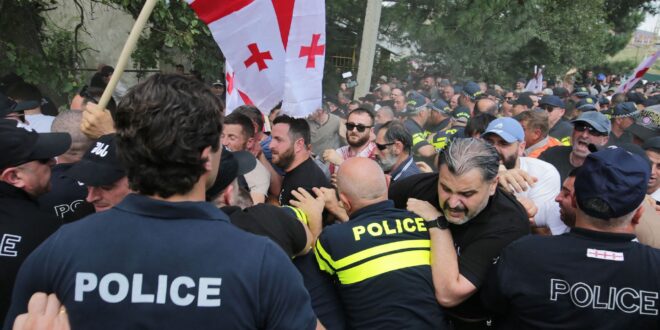 Anti-LGBTQ+ activists clash with police as they try to interfere with a gathering of the LGBTQ+ community for the Tbilisi Pride Festival in Tbilisi in July 2023. (Photo courtesy of AFP via Getty Images)