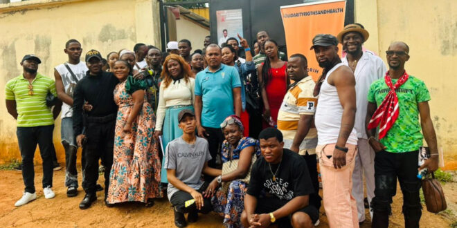 Participants pose for a photo at the Legal Cafe that's a regular monthly event.