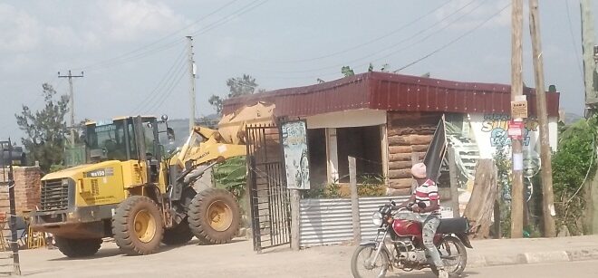 One of the illegal structures being demolished