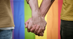 Two men holding hands. (Photo courtesy of Mimoun Kabdani)